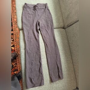 ALO Yoga Women's Black slightly flared leggings with split in middle of leg